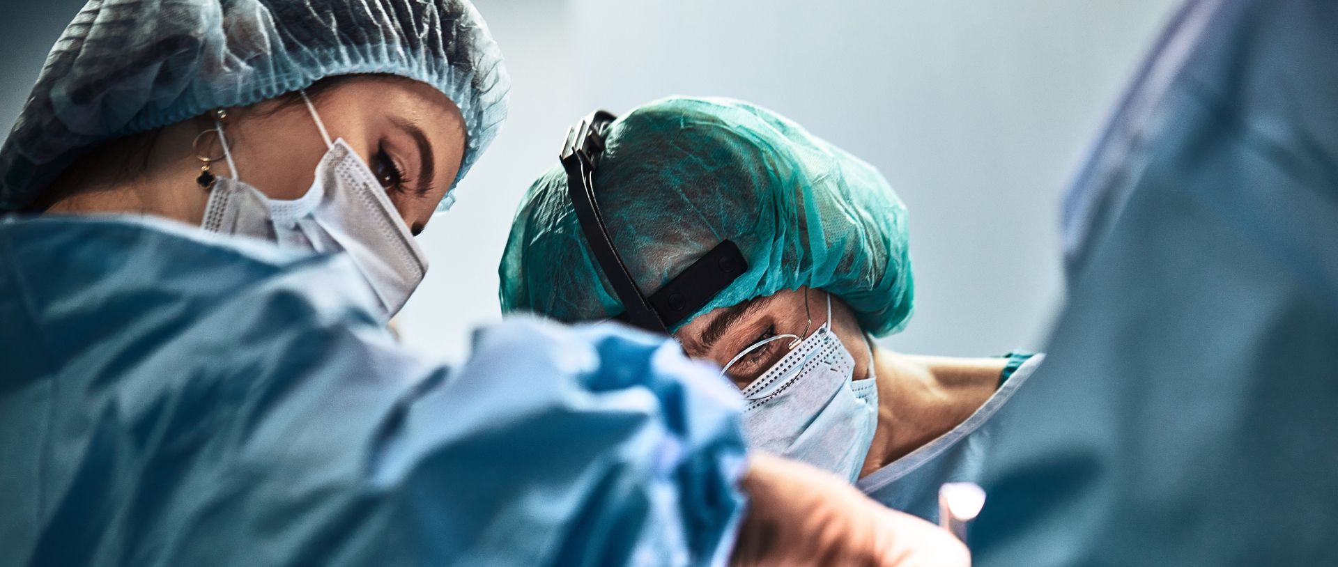 OIC orthopaedic surgical team in operating room — high-value implant solutions